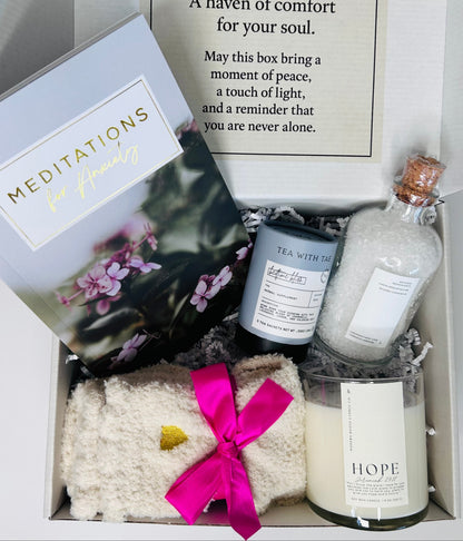 Anxiety and Peace Box showing 31-day meditation booklet, Nighttime Routine Sleep Tea by Tea with Tae, lavender bath salts, Hope soy candle with Jeremiah 29:11 verse, and cozy socks arranged together