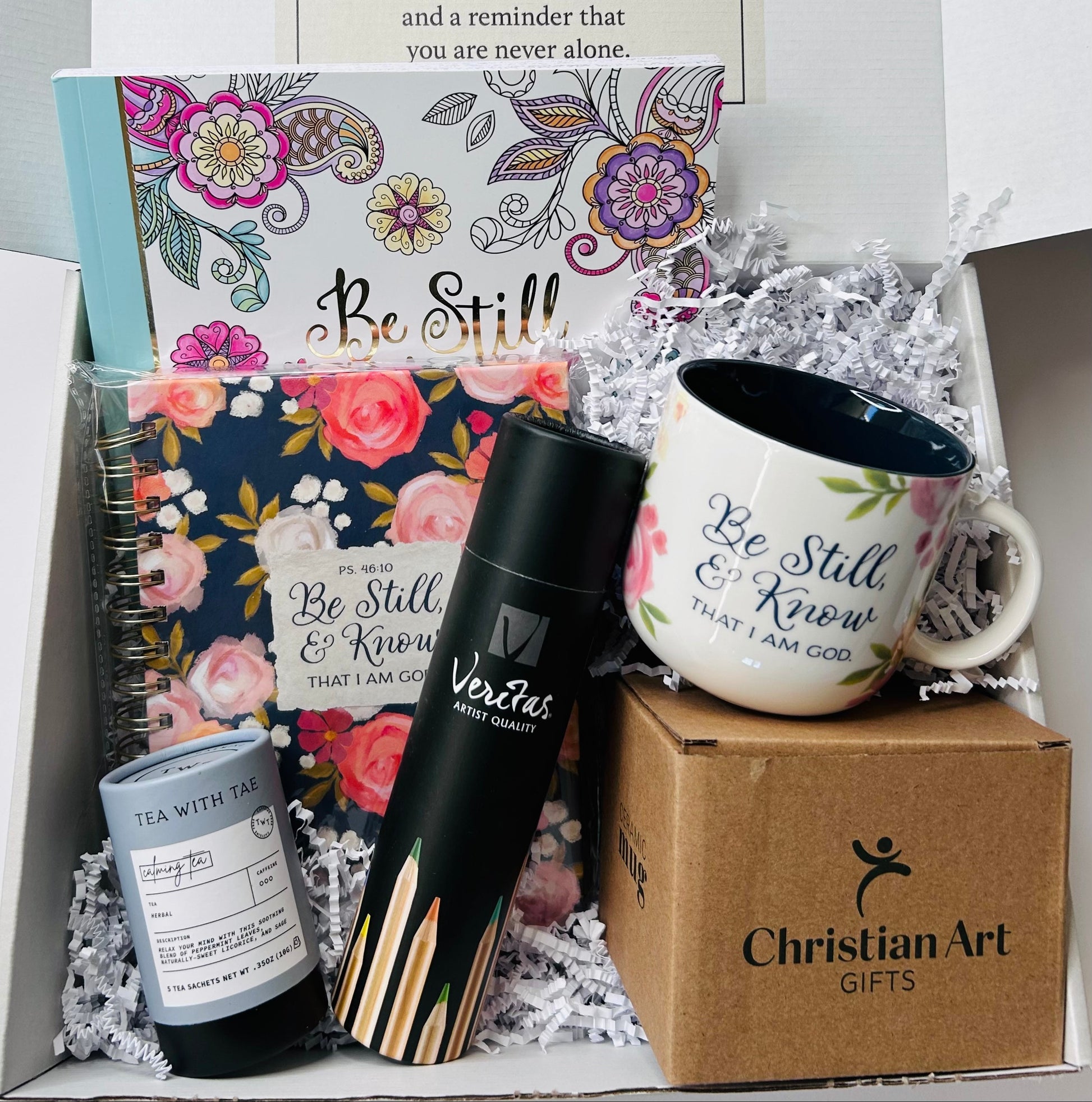 Be Still & Know Encouragement & Uplift gift box with journal, coloring book, floral mug, calming tea, and colored pencils