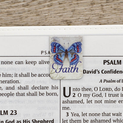 Faith butterfly magnetic bookmark clipped on Bible showing how bookmark securely holds page - mini magnetic bookmark set perfect for marking Scripture passages during Bible study and devotional time