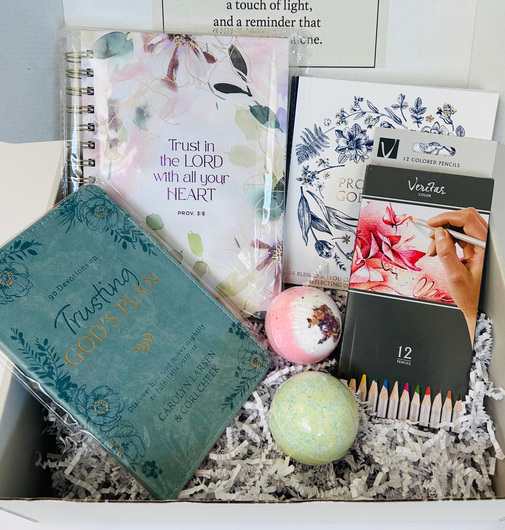 Trust in the Lord anxiety and peace care box with 365 Promises coloring book, Trust in the Lord journal, devotional, colored pencils and bath bombs arranged in Soul Haven gift box