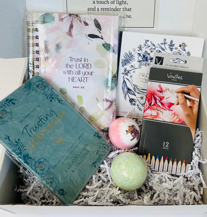 Trust in the Lord anxiety and peace care box with 365 Promises coloring book, Trust in the Lord journal, devotional, colored pencils and bath bombs arranged in Soul Haven gift box