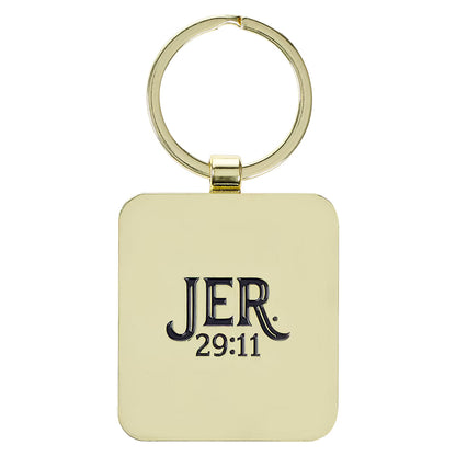 Back of Plans to Give You Hope and a Future black epoxy-coated metal keychain with gold text reading JER 29:11 included in Teen Boy Blessing Box
