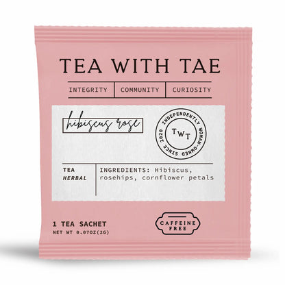 Pink tea sachet with 'Tea with Tae' branding with ingredients information on a white background 